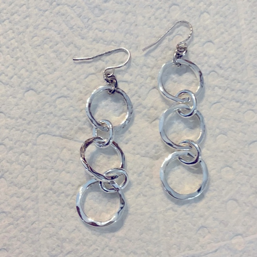 Silver plated dangle earrings that are 2 inches long and great condition.